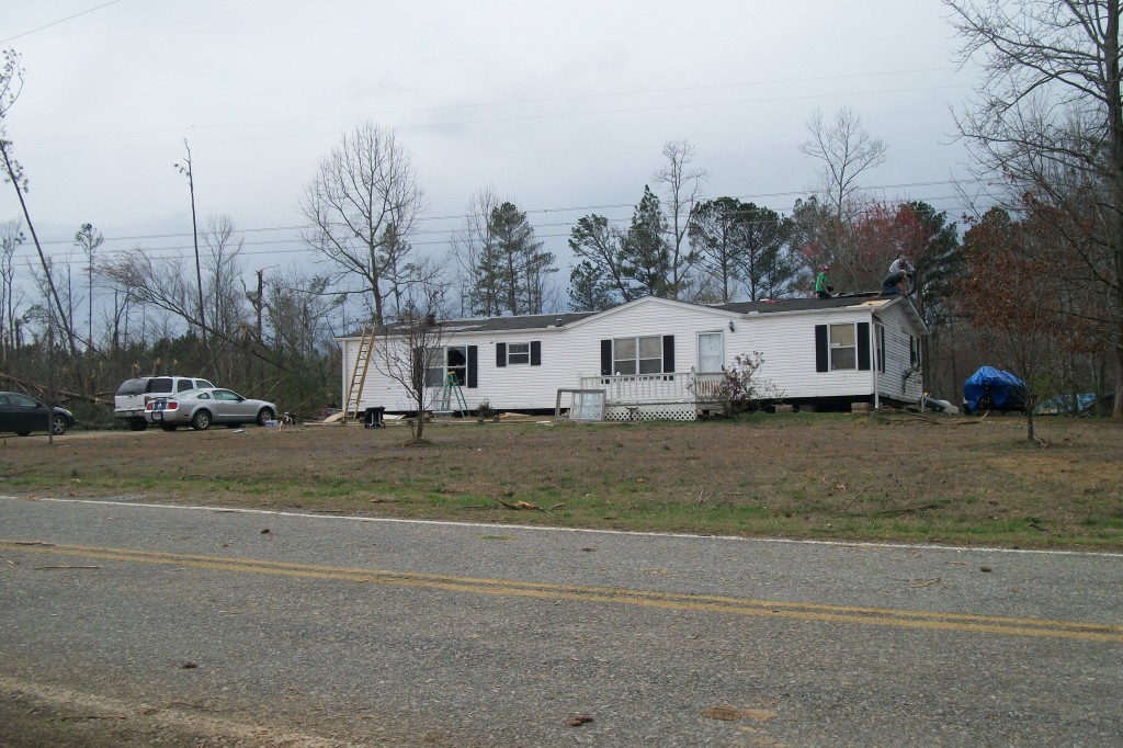 A home in Haralson County that sustained roof damage, and broken windows.